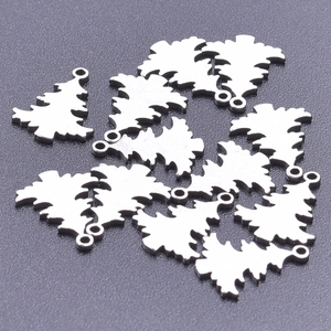 Detailed macro view of silver stainless steel Christmas tree pendants for jewelry making