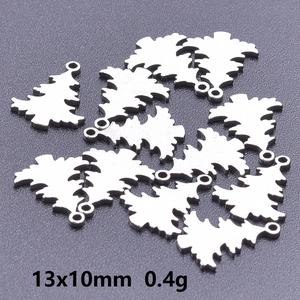 Macro view of 13x10mm stainless steel Christmas tree charms weighing 0.4g each