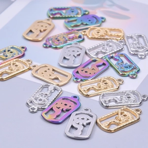 Detail of snake and evil eye hollow charms in gold, silver, and rainbow finishes