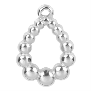 Detailed macro view of silver polished teardrop bead charm with mirror finish for DIY jewelry