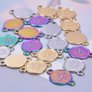 Detailed macro view of 18k gold and silver tree pattern round jewelry DIY charms