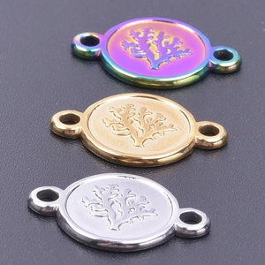 Macro detail of oval coral relief pendants in gold silver and rainbow for DIY jewelry