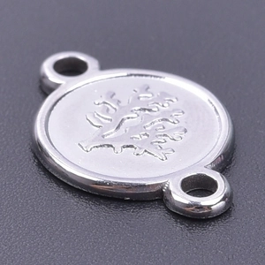 Macro shot of stainless steel tree-patterned double-link connector for DIY necklaces