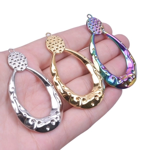 Textured hollow teardrop pendant in gold, silver, and iridescent 18k plated stainless steel