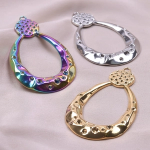 Detail of 18k gold plated stainless steel teardrop pendants with hammered texture
