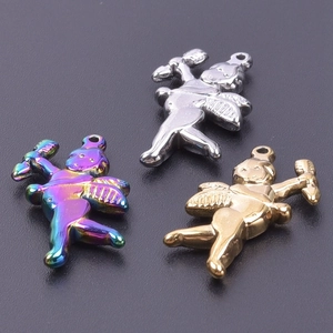 Macro shot of 18k gold and silver cupid angel pendants for DIY jewelry making