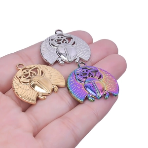 Three-piece stainless steel scarab beetle charms in gold silver and rainbow finishes