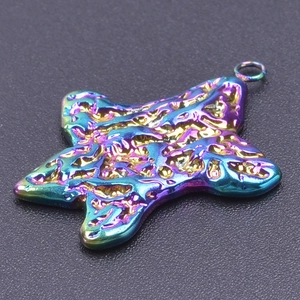 Macro shot of 18k plated rainbow star pendant with molten lava texture for DIY necklaces