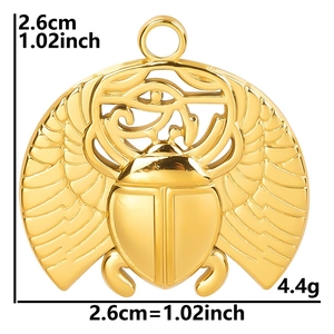 Detailed view of gold stainless steel beetle scarab pendant with Eye of Horus carving