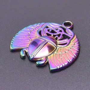 Macro view of rainbow vacuum-plated stainless steel scarab pendant with hollow wings