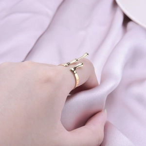 Artistic gold molten lava ring in stainless steel with an asymmetrical open design