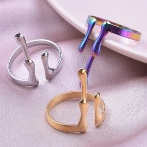 Three-piece set of fluid lava style stainless steel rings in gold, silver, and rainbow