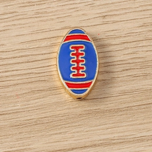 Macro detail of royal blue enamel rugby pendants with gold stitching for DIY jewelry