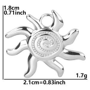 Macro view of sun pendant with spiral texture and silver finish for DIY necklaces