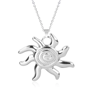 Macro shot of silver sun pendant with spiral texture and 18k plated stainless steel chain