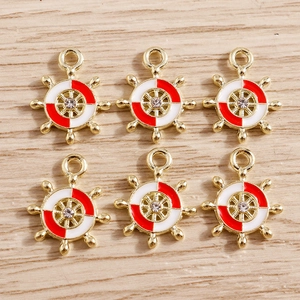 Ship wheel charms for jewelry making featuring red white enamel and gold finish
