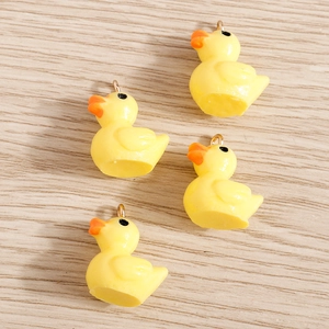 Pack of 10 resin yellow duck charms with gold metal loops for DIY jewelry making