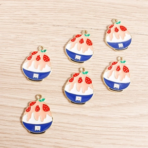Detailed view of DIY strawberry shaved ice enamel alloy charms with gold metal loops