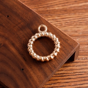 Golden twisted rope circle pendant for DIY jewelry making and geometric fashion accessories