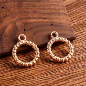 Golden alloy twisted ring pendants for DIY jewelry with elegant metal texture