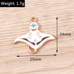 Detail of rose gold manta ray enamel pendant with dimensions 24x25mm and 1.7g weight