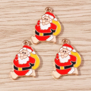 Detail of Christmas Santa Claus enamel charms with rose gold edges for DIY jewelry making