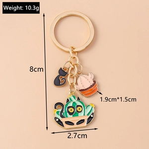 Detailed view of cat and cactus keychains with dimensions 8cm and weight 10.3g