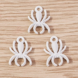 Three white enamel spider charms with metal rings for creative DIY jewelry making