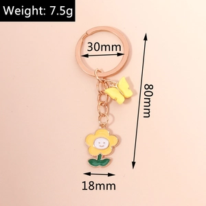 Detailed size view of yellow enamel butterfly and sunflower keychain with 80mm length