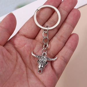Vintage silver bull head keychain with engraved patterns and turquoise stone details