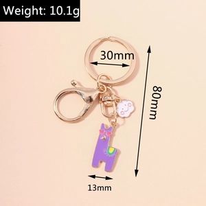 Detail view of purple alpaca keychain with weight and size parameters on beige background