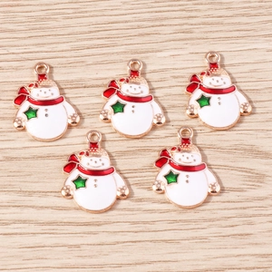 Detailed view of five snowman enamel charms with red scarves and gold alloy edges