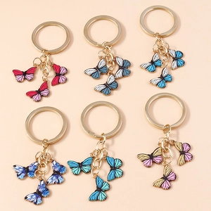 Porte-clés Papillon en Alliage à la Mode Avec Pendentifs en Émail à Rayures Colorées Anneau en Métal Doré Charme Sac Femme