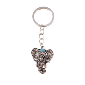Vintage elephant keychain with turquoise stone and ethnic hollow silver alloy design