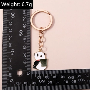 Vue détaillée montrant les dimensions du porte-clés panda avec une règle de mesure noire
