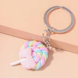 Detail of macaron rainbow lollipop keychain with pink bow and silver metal ring
