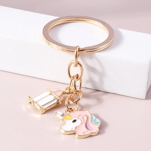 Porte-clés licorne et lanterne rose avec finition dorée pour accessoire de sac