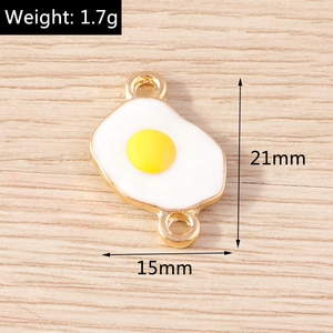Detailed view of fried egg charms with 21x15mm dimensions and two connector loops