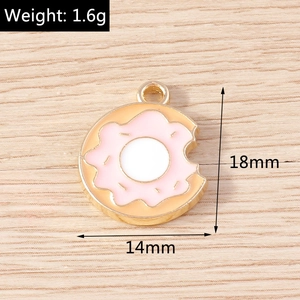 Detail showing dimensions and weight of a pink donut alloy charm with gold loop