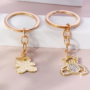Sparkling crystal bear keychains in rose gold featuring hollow out and heart textures