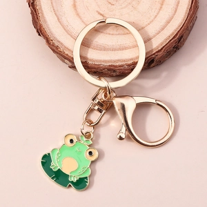 Porte-clés grenouille sur nénuphar en alliage doré et émail vert pour sac à dos