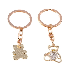 Rose gold bear keychains with hollow crystal inlay and embossed heart pattern textures