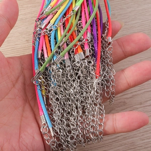 Detailed view of colorful waxed cord necklaces with silver lobster clasps and extenders