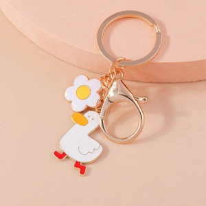 Cute cartoon white duck and floral charm keychain with golden hardware and lobster clasp