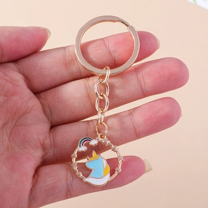 Cartoon unicorn keychain with golden star ring and rainbow charm for backpack decor