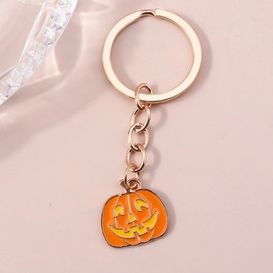 Porte-clés citrouille d'Halloween avec anneau en métal rose doré et émail de citrouille