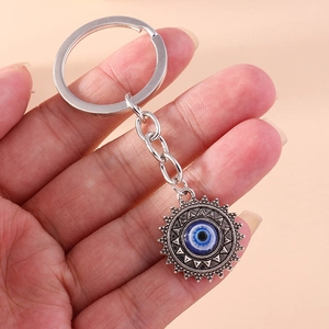 Porte-clés Rétro Mauvais Œil Pendentif Soleil Nazar Amulette Charme de Sac Boho Hippie Métal Argenté Cadeau Homme Femme