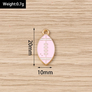 Detailed view of pink enamel rugby pendant charms with 20mm height measurements