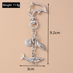 Macro detail showing ocean shark keychain dimensions with length and weight measurements