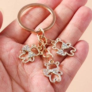 Golden luxury bear keychain with hollow pendants and colorful rhinestones for handbags